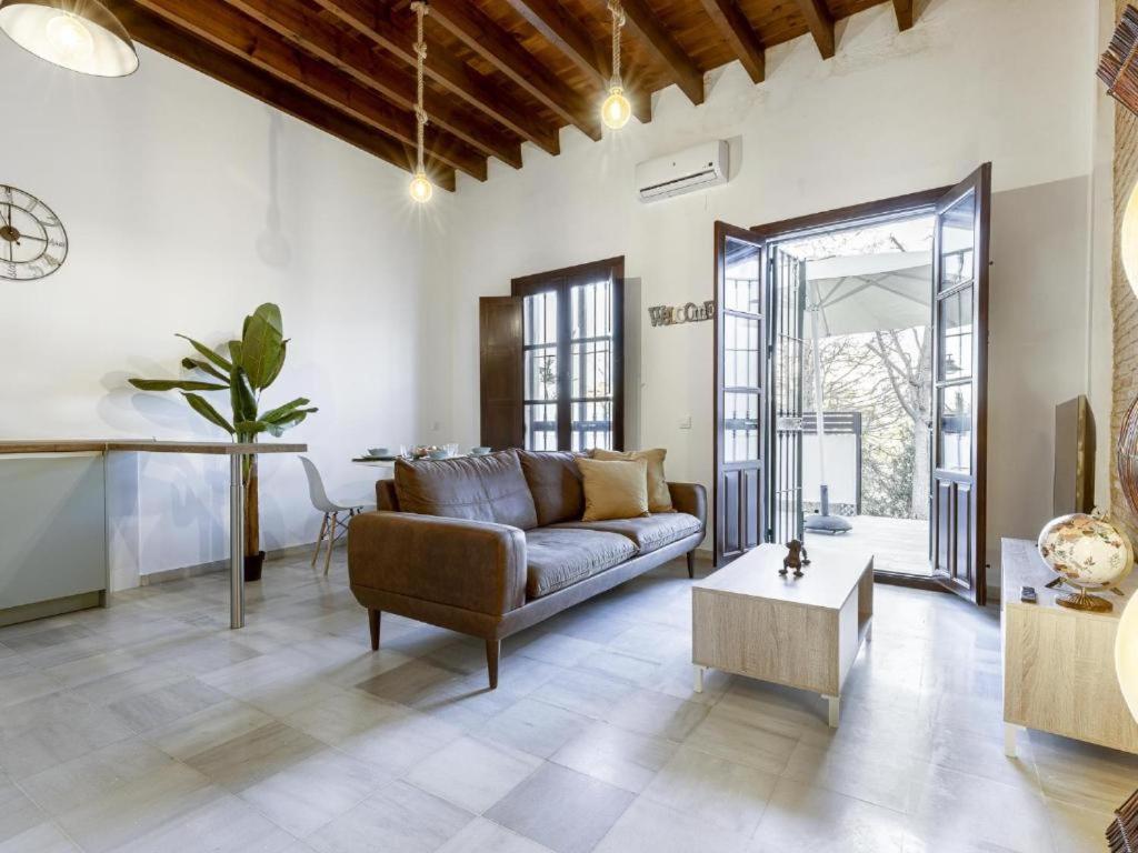 a living room with a couch and a table at Terraza de Triana in Seville