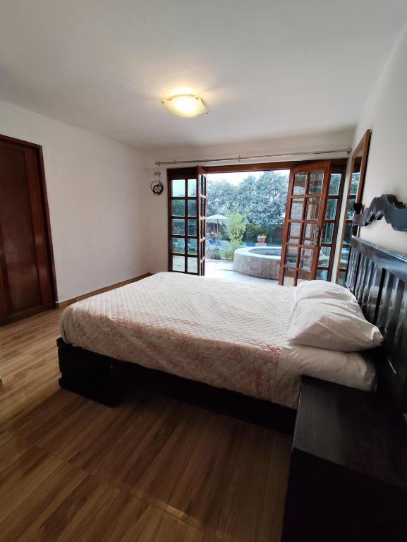 Postel nebo postele na pokoji v ubytování Casa Campo Isabel Quinteros
