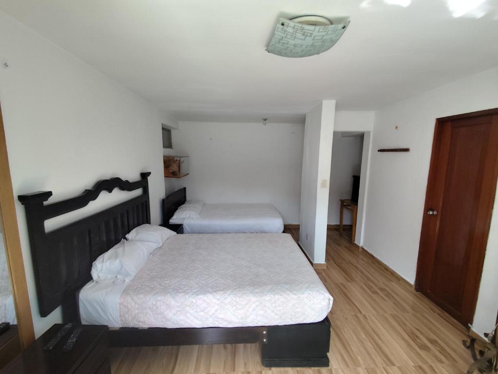 Postel nebo postele na pokoji v ubytování Casa Campo Isabel Quinteros