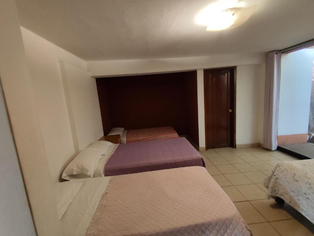 Postel nebo postele na pokoji v ubytování Casa Campo Isabel Quinteros