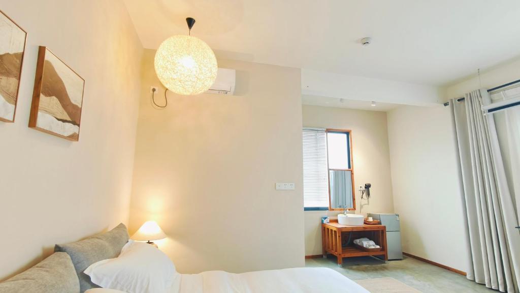 Postel nebo postele na pokoji v ubytování Cozy Li Riverside Inn
