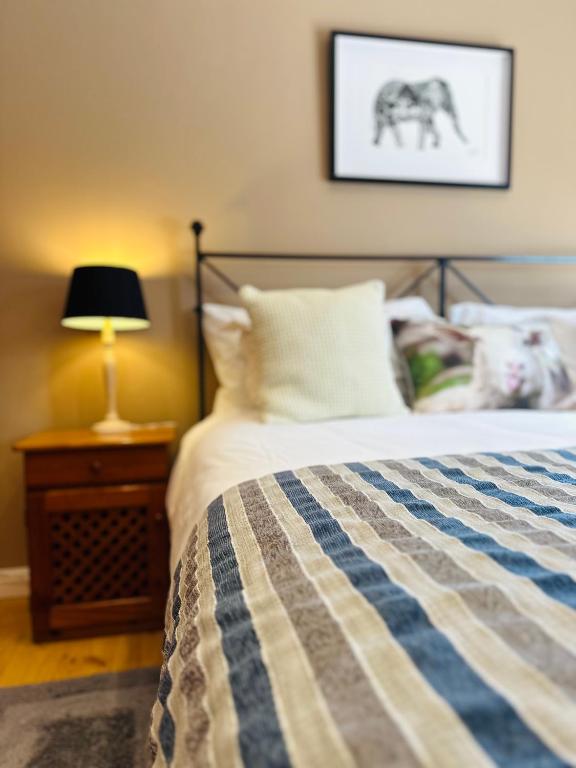 Postel nebo postele na pokoji v ubytování Vine Guesthouse