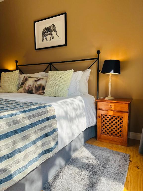 Postel nebo postele na pokoji v ubytování Vine Guesthouse