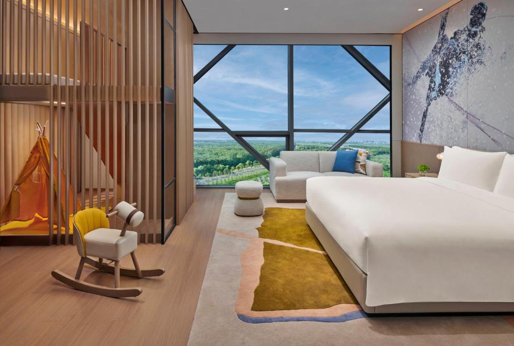 Postel nebo postele na pokoji v ubytování Crowne Plaza Shanghai Snow World by IHG