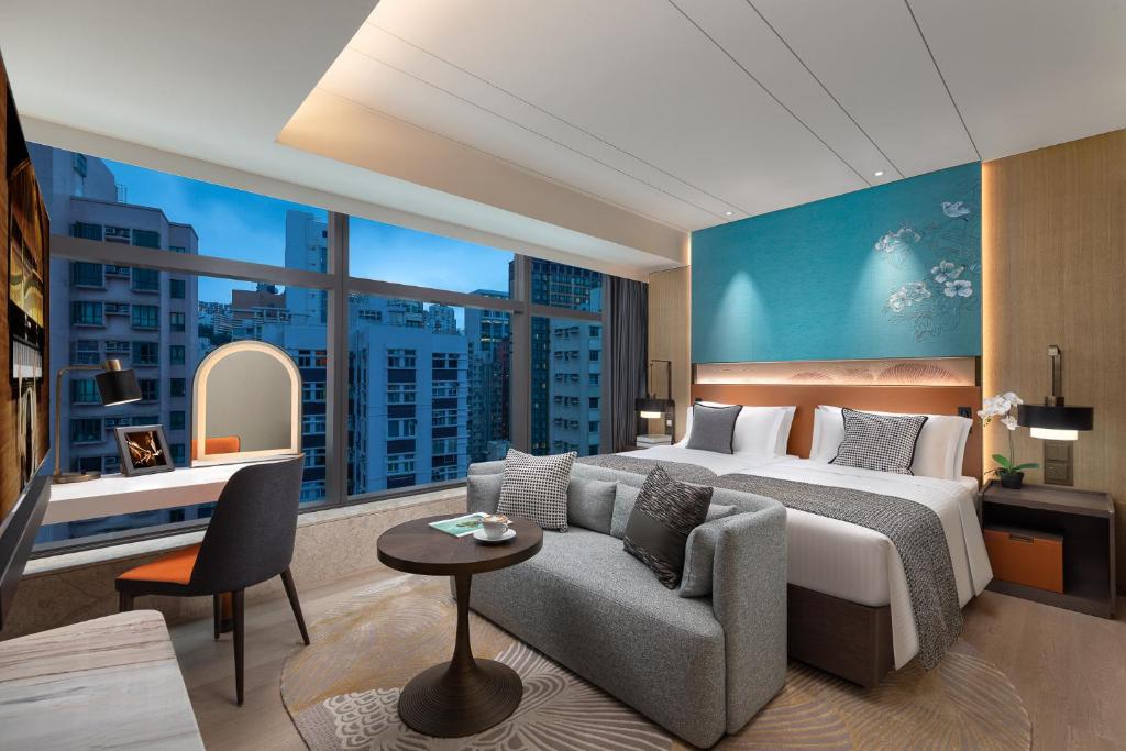 Łóżko lub łóżka w pokoju w obiekcie Ascott North Point Hong Kong