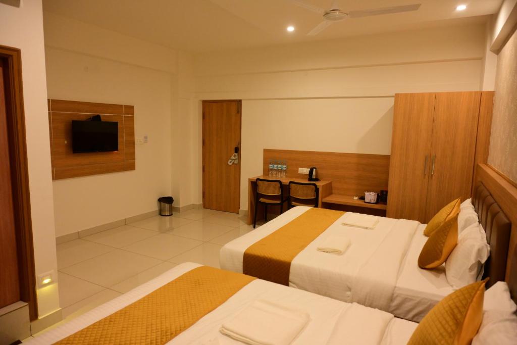 Postel nebo postele na pokoji v ubytování Bimba Hotels