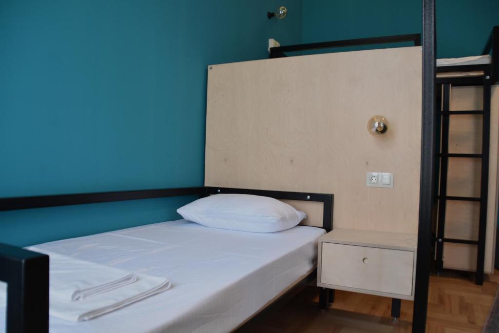 Postel nebo postele na pokoji v ubytování Communa Good Vibes
