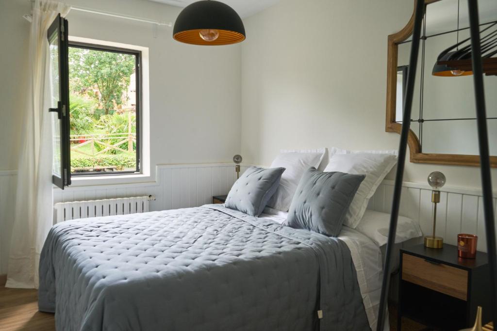 Postel nebo postele na pokoji v ubytování Habitación azul en casa con encanto