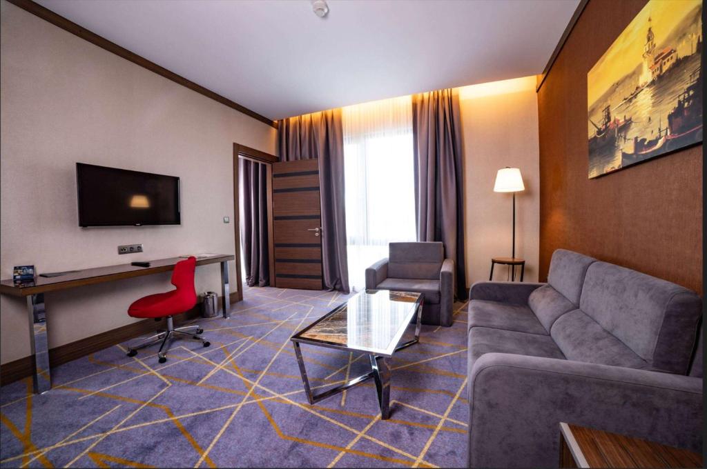 A television and/or entertainment centre at Ramada by Wyndham Istanbul Alibeykoy