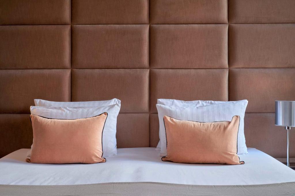 Postel nebo postele na pokoji v ubytování Flemings Selection Hotel Frankfurt-City