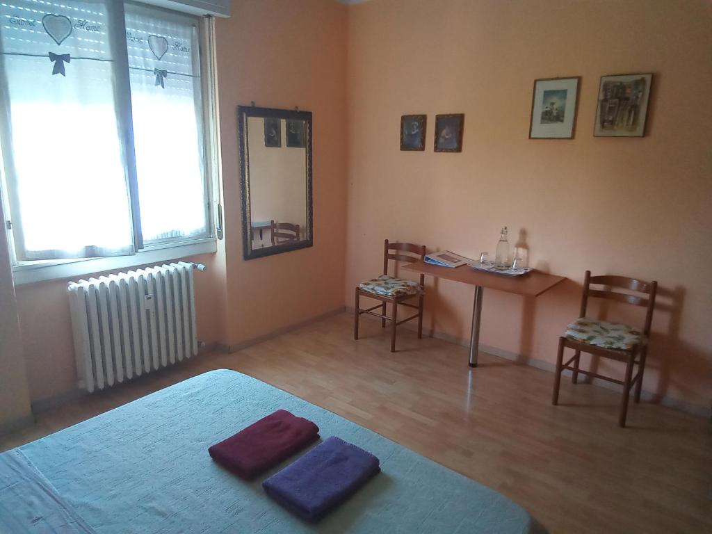 Postel nebo postele na pokoji v ubytování Stanza ai Colli
