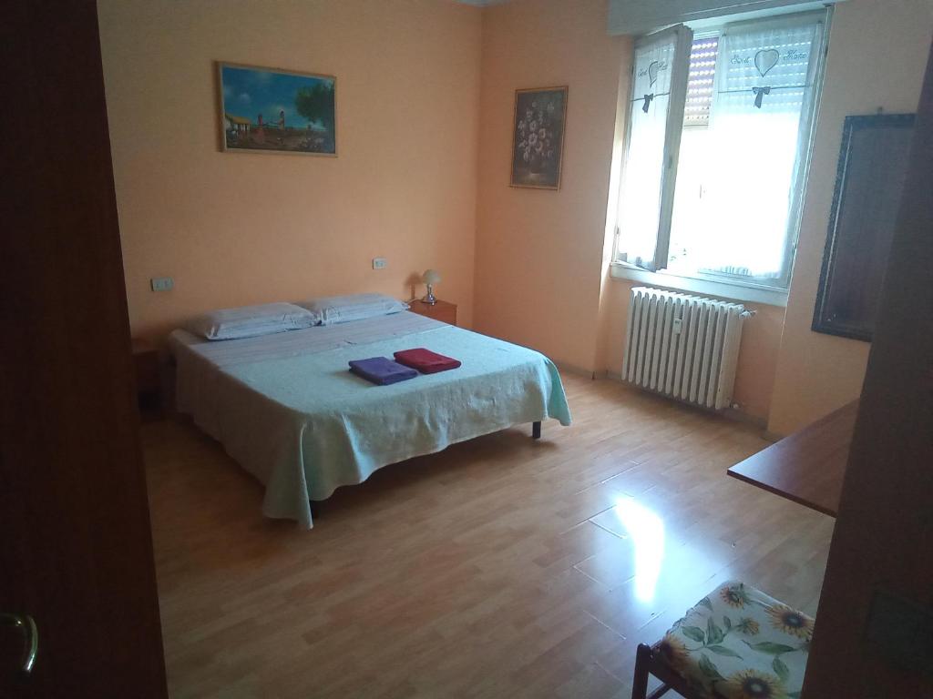 Postel nebo postele na pokoji v ubytování Stanza ai Colli