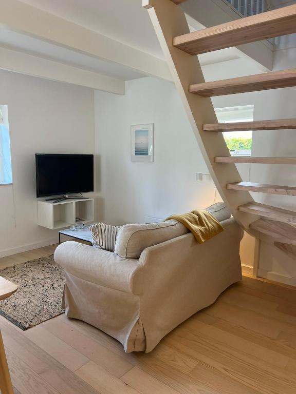 TV a/nebo společenská místnost v ubytování Beach Guest House