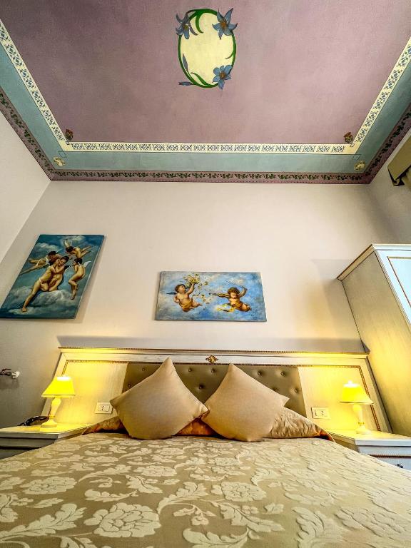 Postel nebo postele na pokoji v ubytování Hotel Genova Liberty