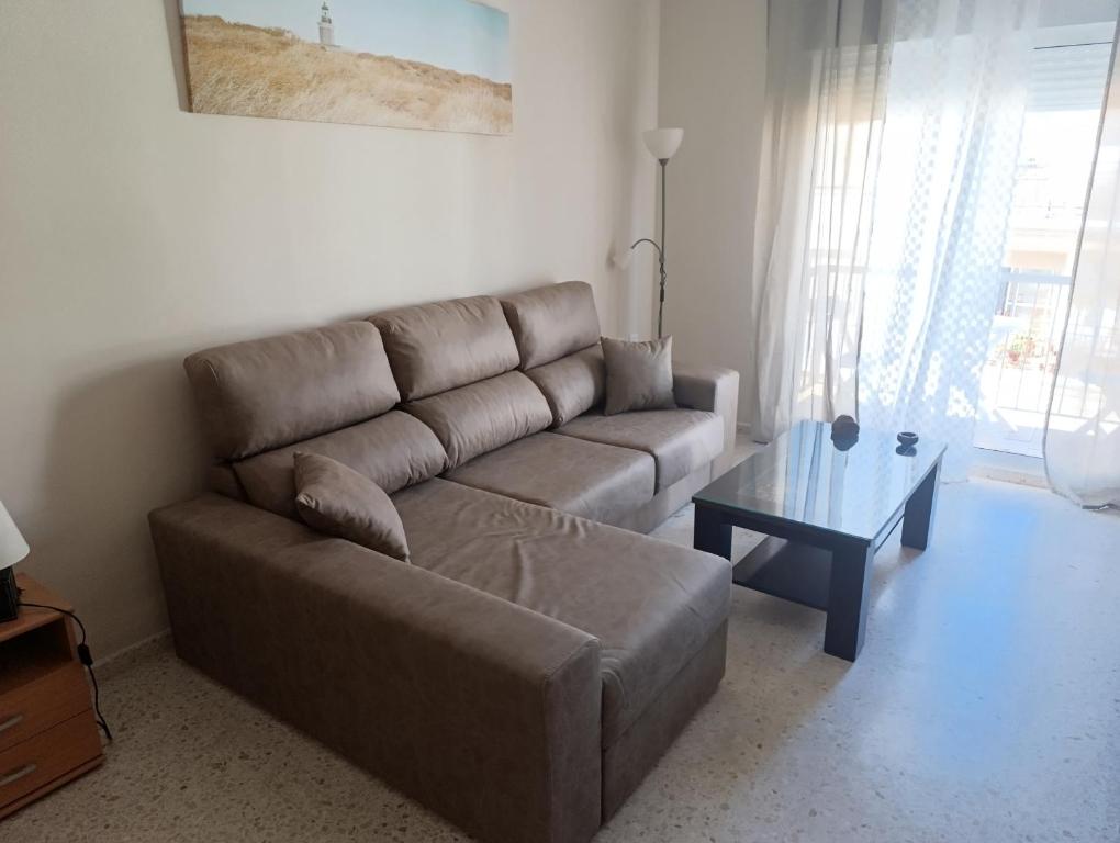 a living room with a couch and a table at Puerto Barrio Alto in El Puerto de Santa María