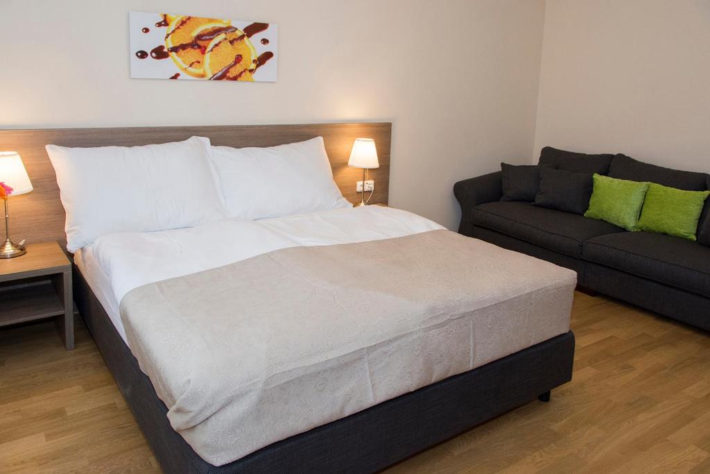 Postel nebo postele na pokoji v ubytování Limes Apartments