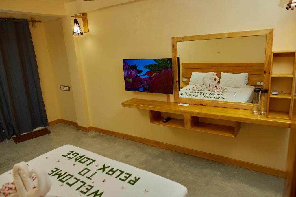 Postel nebo postele na pokoji v ubytování Relax Lodge