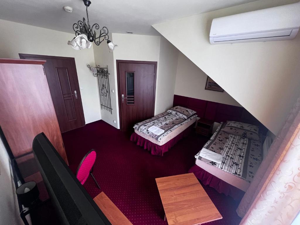 Postel nebo postele na pokoji v ubytování Zajazd Skorpion B&B