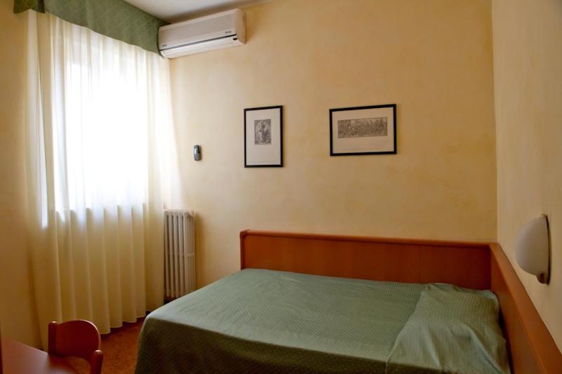 Postel nebo postele na pokoji v ubytování Hotel Europa