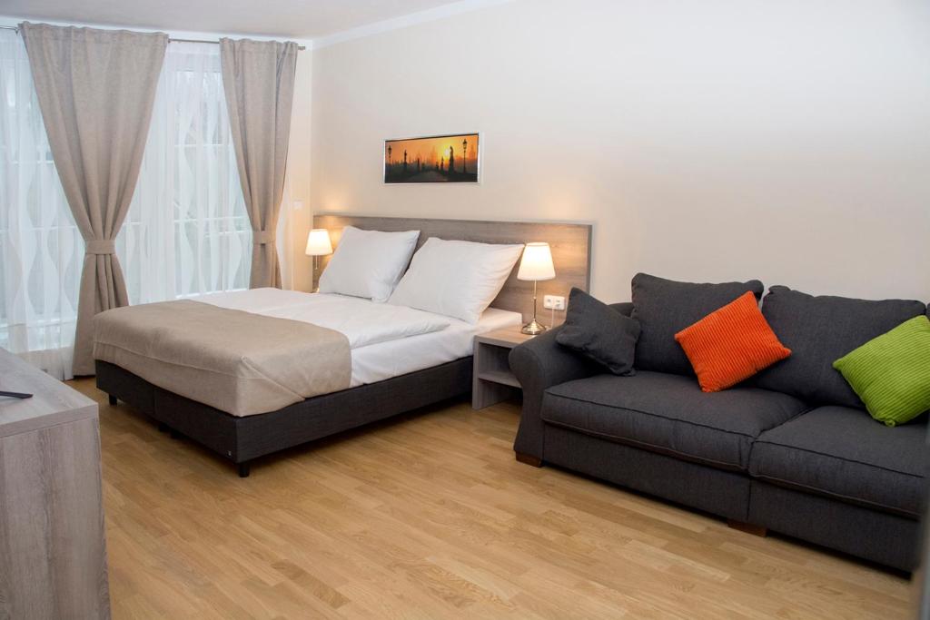Postel nebo postele na pokoji v ubytování Limes Apartments