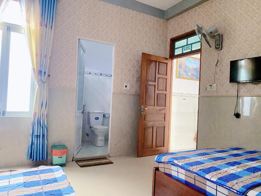 Ένα ή περισσότερα κρεβάτια σε δωμάτιο στο Nhà nghỉ THANH TRÚC