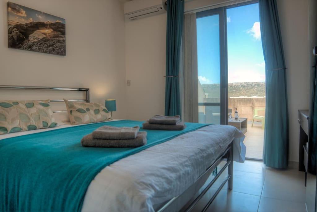 Rúm í herbergi á SeaHorse Penthouse