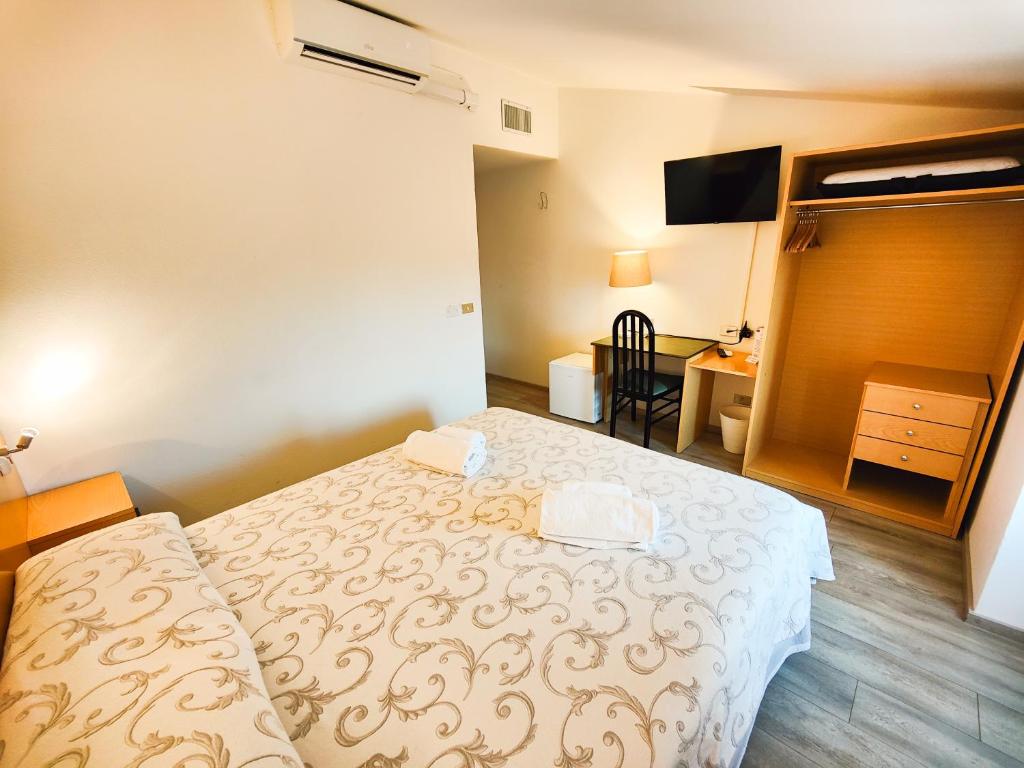 Postel nebo postele na pokoji v ubytování Albergo B&B Tenesi