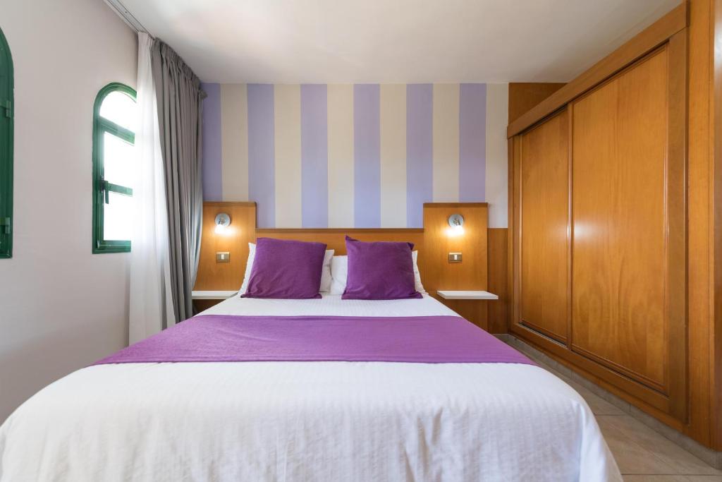 Postel nebo postele na pokoji v ubytování eó Maspalomas Resort