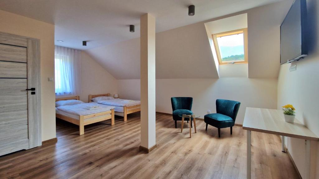 Postel nebo postele na pokoji v ubytování Wisienka