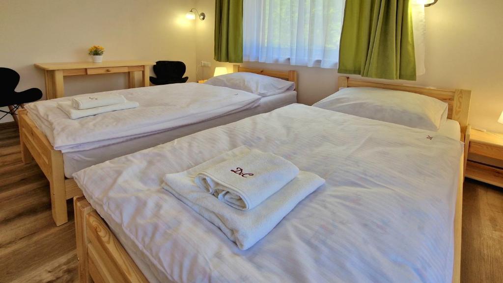 Postel nebo postele na pokoji v ubytování Wisienka