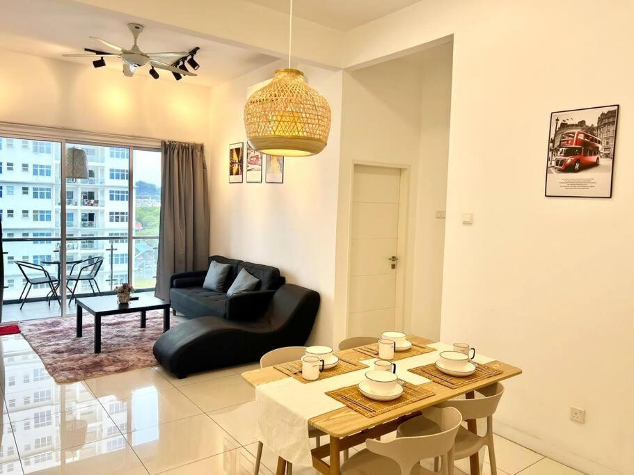 a living room with a table and a couch at SD 1-10Pax Puchong Sky Pod Residence IOI Mall WiFi in Puchong