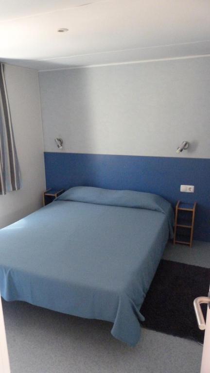 Postel nebo postele na pokoji v ubytování Parque de Campismo Orbitur Sagres