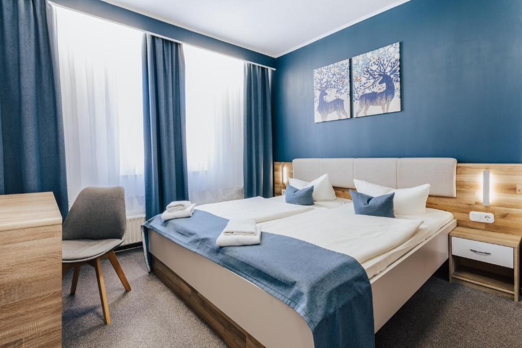 Postel nebo postele na pokoji v ubytování Hotel Wiggers