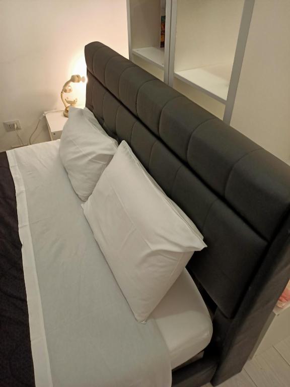 Posteľ alebo postele v izbe v ubytovaní Bologna House Pratello 5