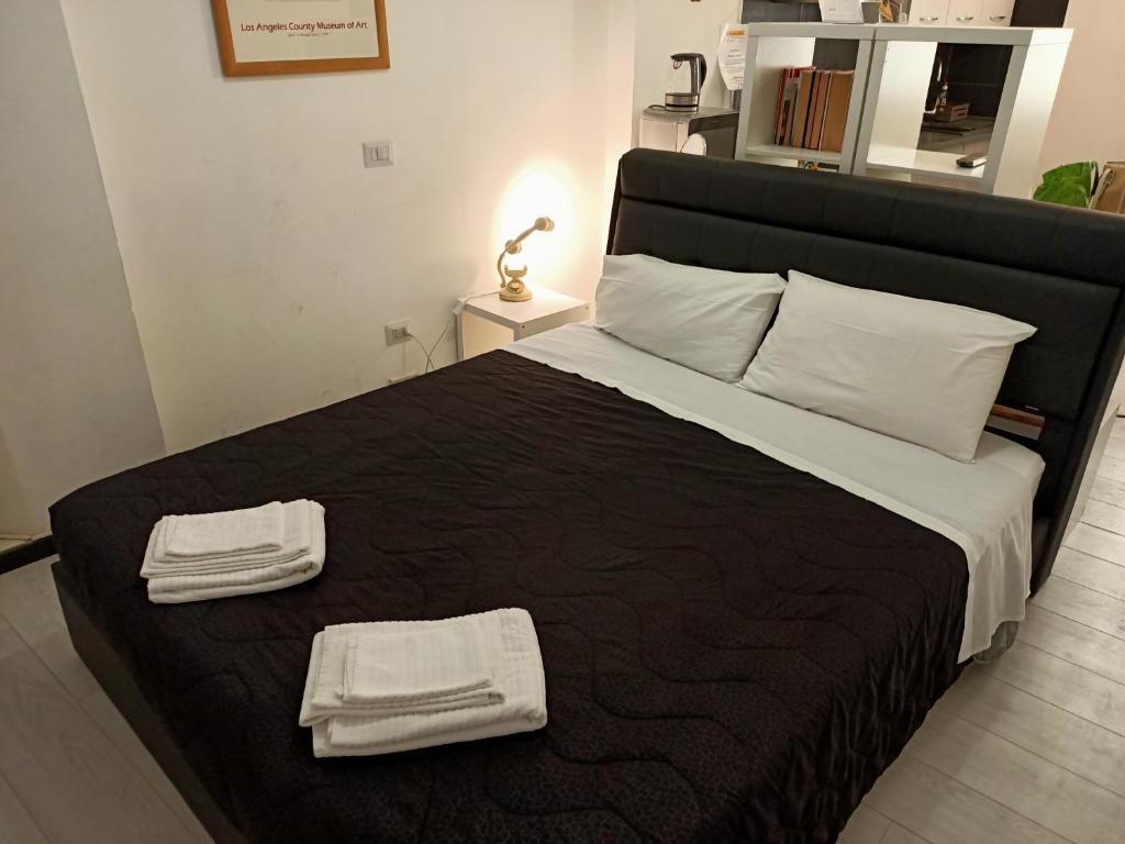 Posteľ alebo postele v izbe v ubytovaní Bologna House Pratello 5