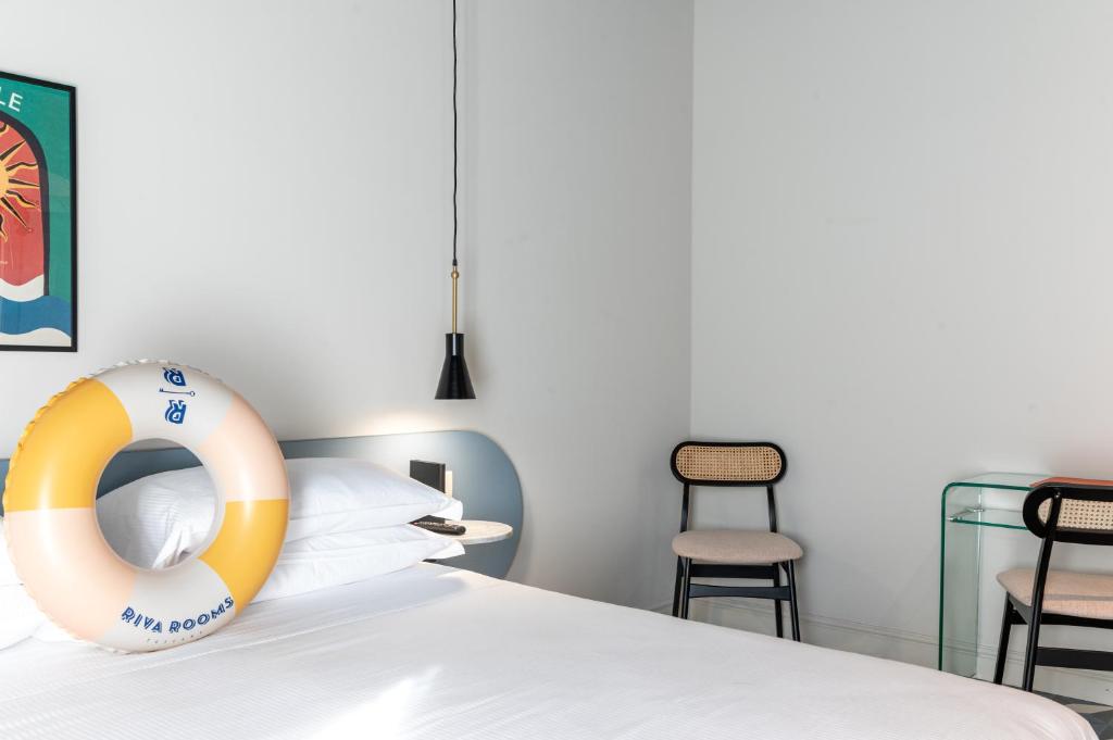 Postel nebo postele na pokoji v ubytování Riva Rooms