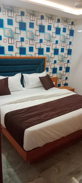 Postel nebo postele na pokoji v ubytování Hotel Nobel Inn