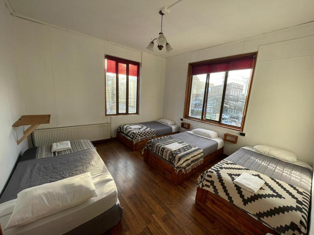 Postel nebo postele na pokoji v ubytování Hostal Ochen