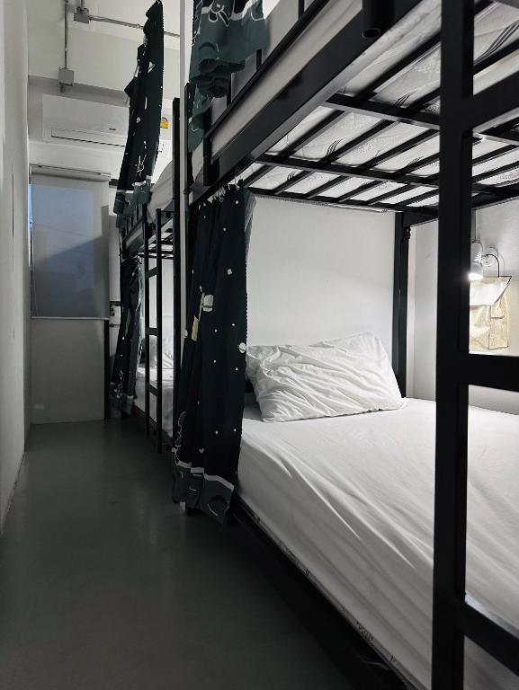 Postel nebo postele na pokoji v ubytování Prachan Hostel