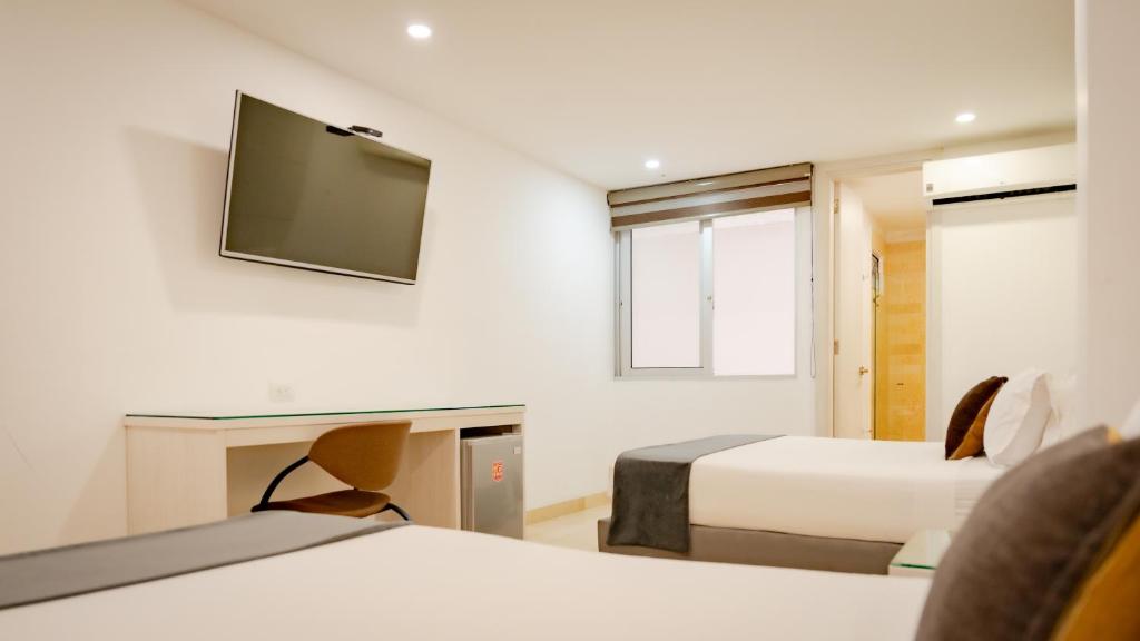 TV a/nebo společenská místnost v ubytování Hotel Madeiro