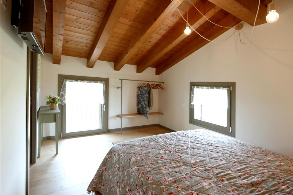 Postel nebo postele na pokoji v ubytování Agriturismo La Rosarnetta