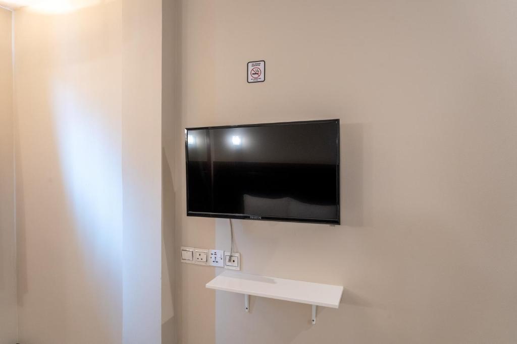 TV a/nebo společenská místnost v ubytování Pertama Lodge