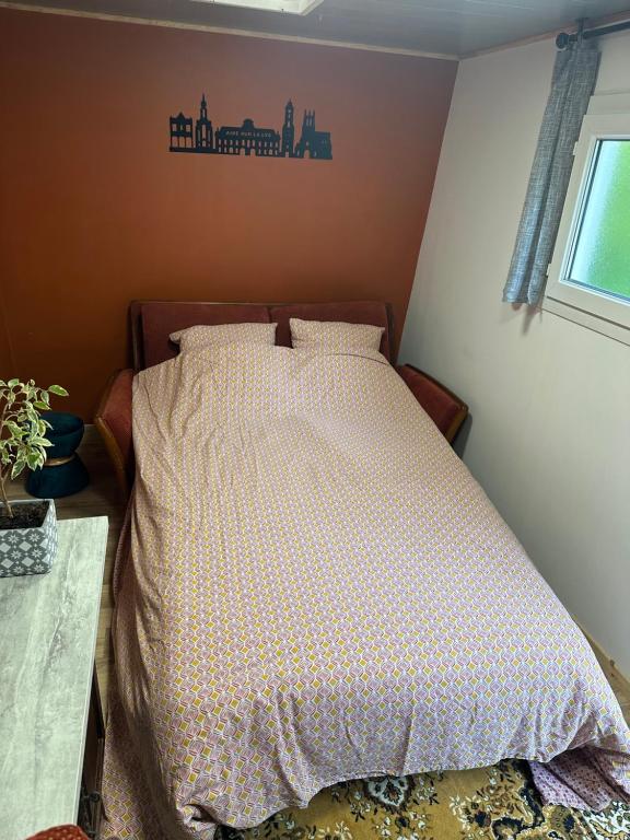Postel nebo postele na pokoji v ubytování La Cabane du Halage