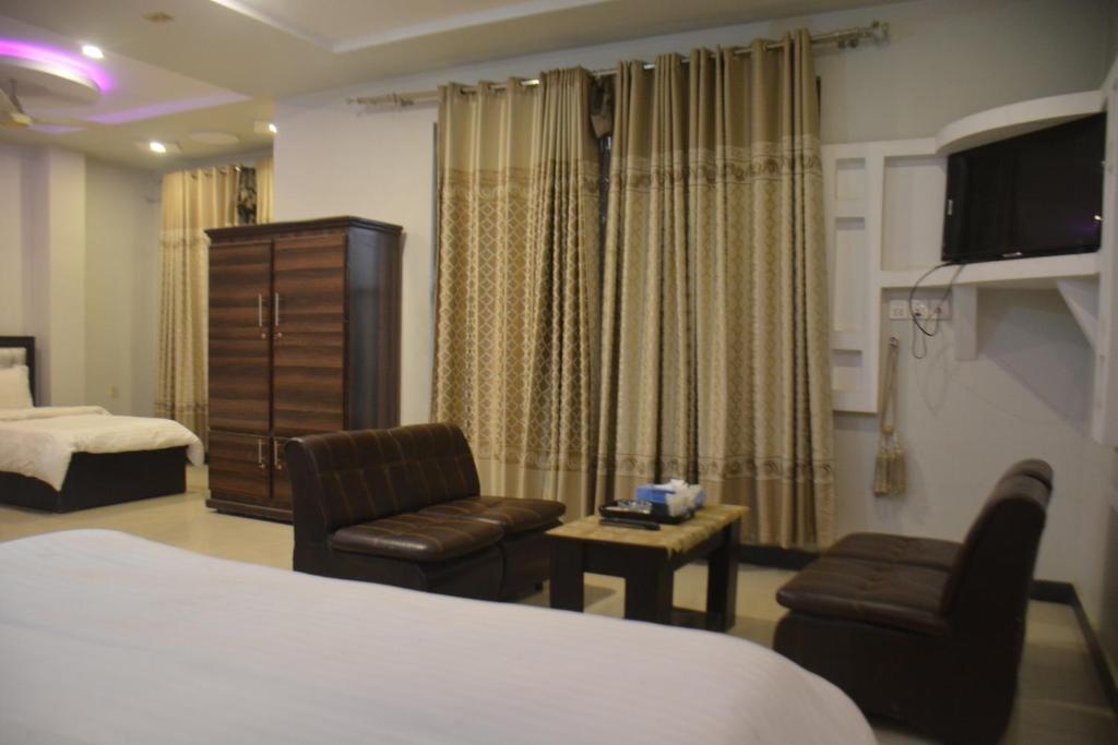Postel nebo postele na pokoji v ubytování Abeer Hotel by LMC
