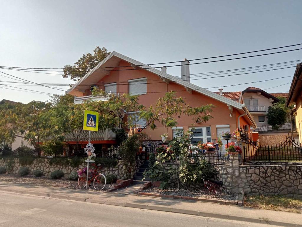 a house with a bike parked in front of it at Stara Ruža in Gračanica