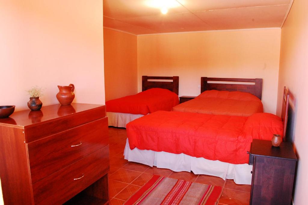Postel nebo postele na pokoji v ubytování Hostal Mirador