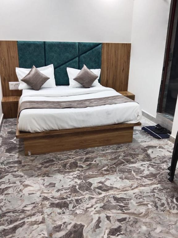 Postel nebo postele na pokoji v ubytování Hotel Sunrise Rooms