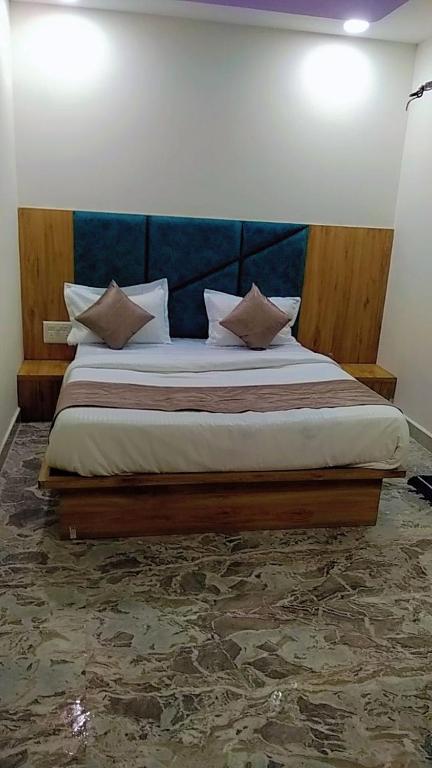 Postel nebo postele na pokoji v ubytování Hotel Sunrise Rooms