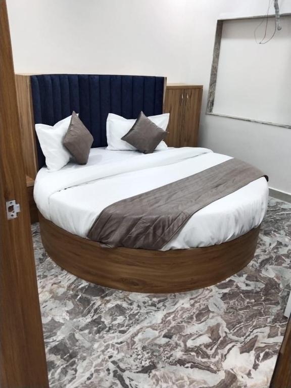 Postel nebo postele na pokoji v ubytování Hotel Sunrise Rooms