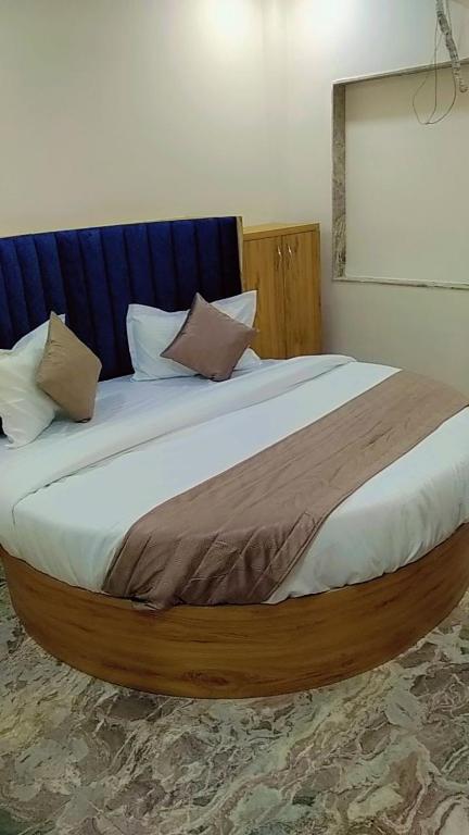 Postel nebo postele na pokoji v ubytování Hotel Sunrise Rooms